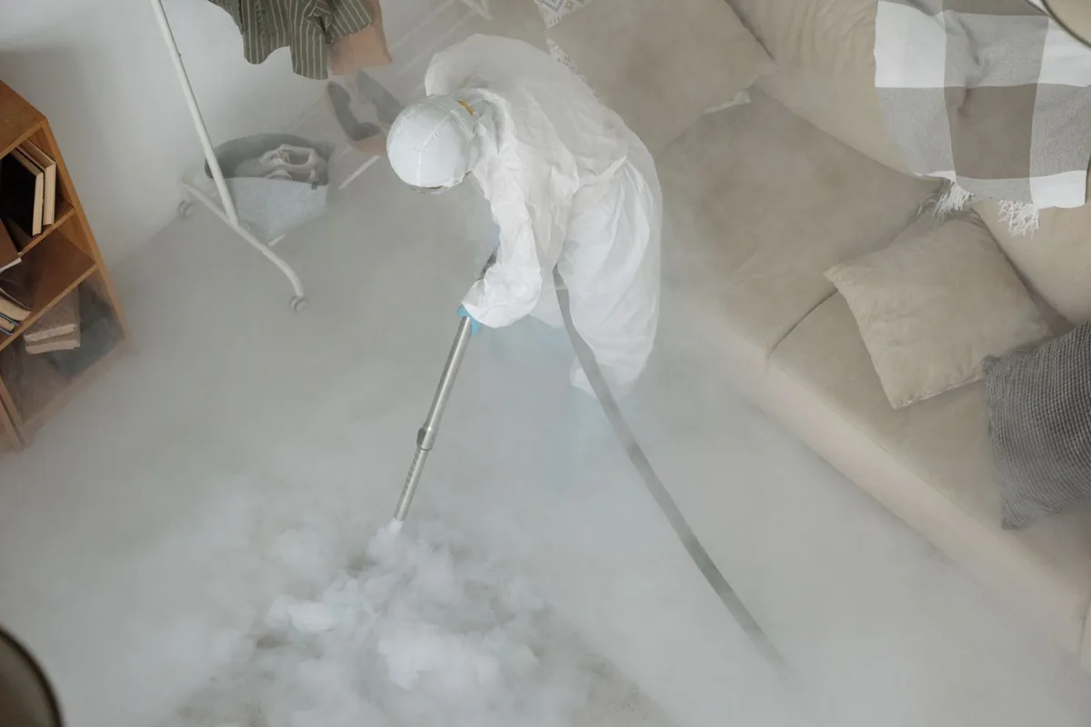 Biohazard cleanup technician in protective equipment, Plainsboro Center, NJ